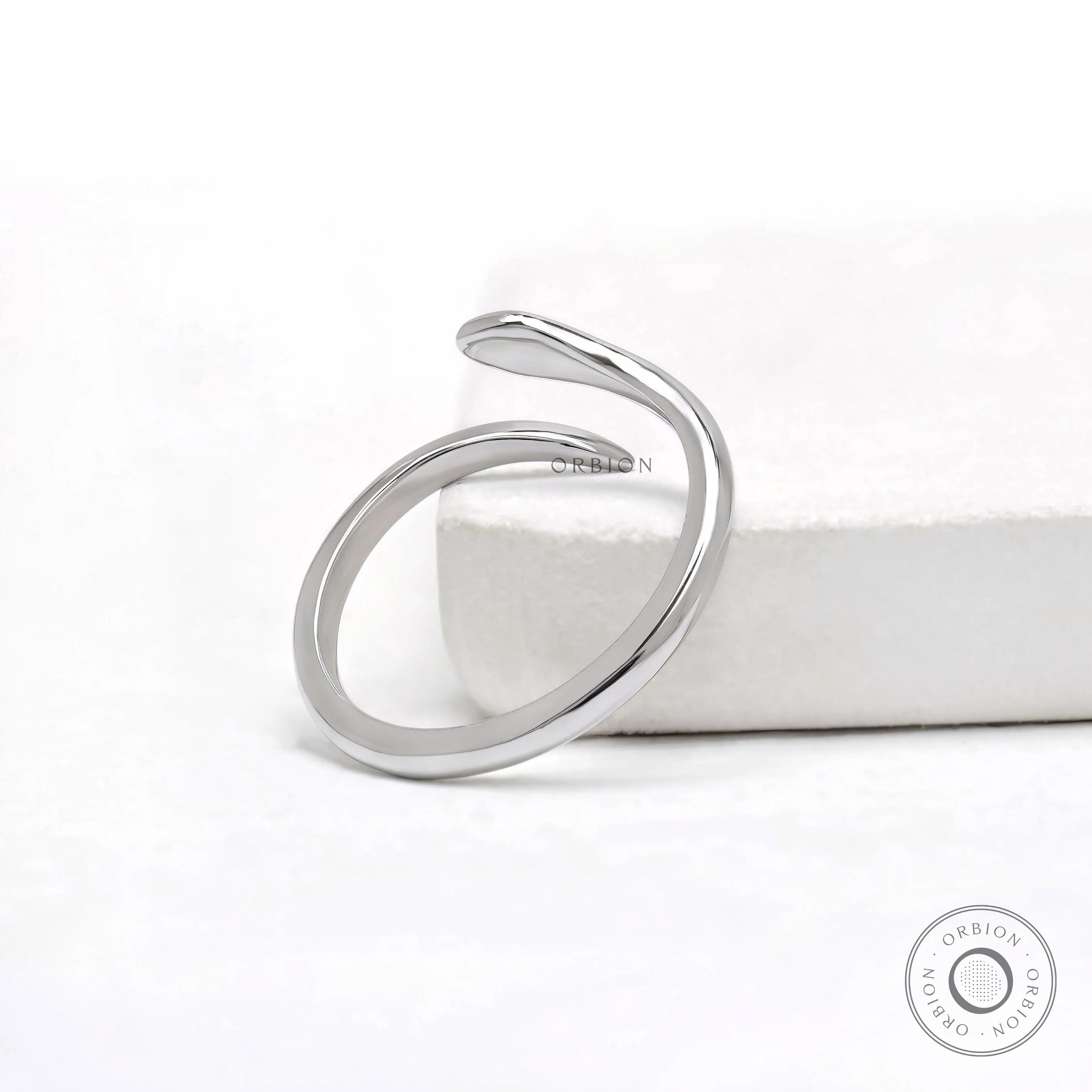 Lightweight 14k white gold snake ring with marquise blue diamond