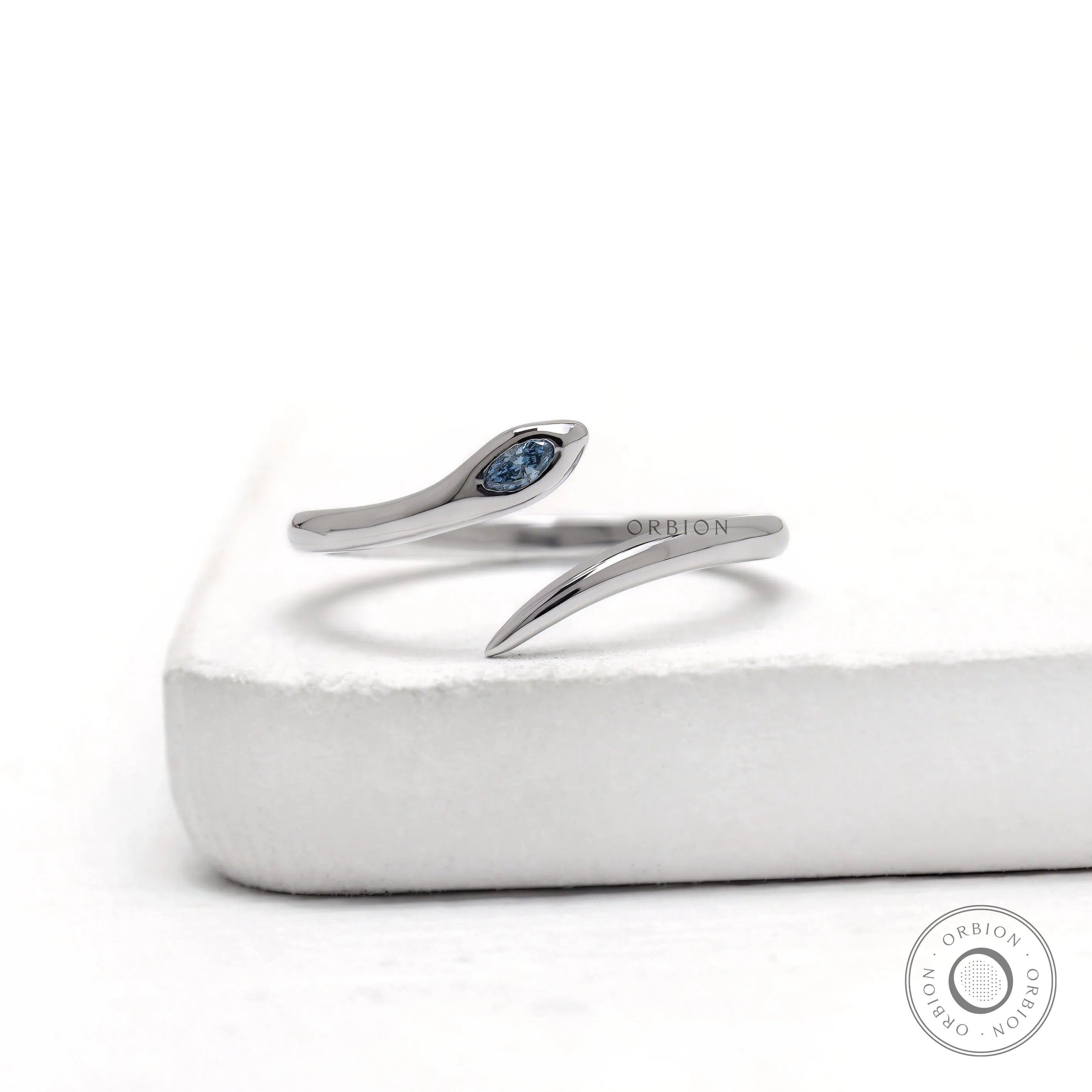 14k white gold snake blue diamond open wrap ring with flush set marquise stone
