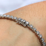 Close up of round cut lab diamond white gold tennis bracelet clasp detail