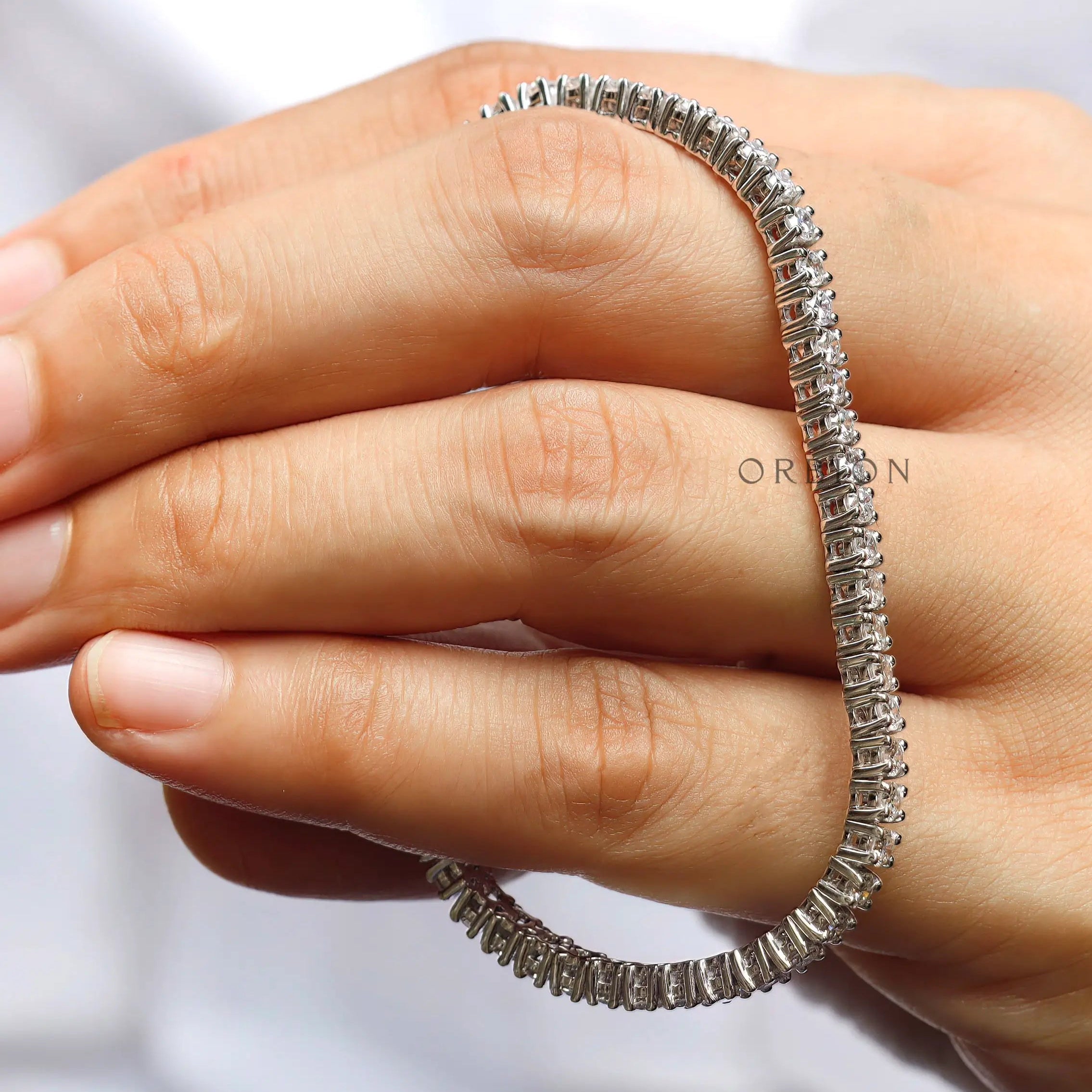 High polish white gold moissanite tennis bracelet design