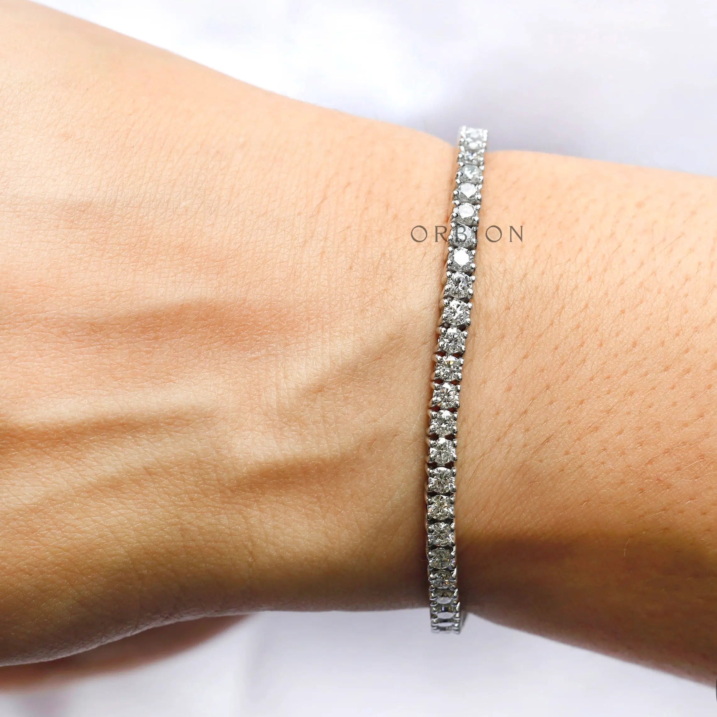 10K white gold round colorless moissanite tennis bracelet
