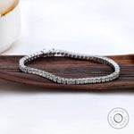 Prong set moissanite tennis bracelet in white gold