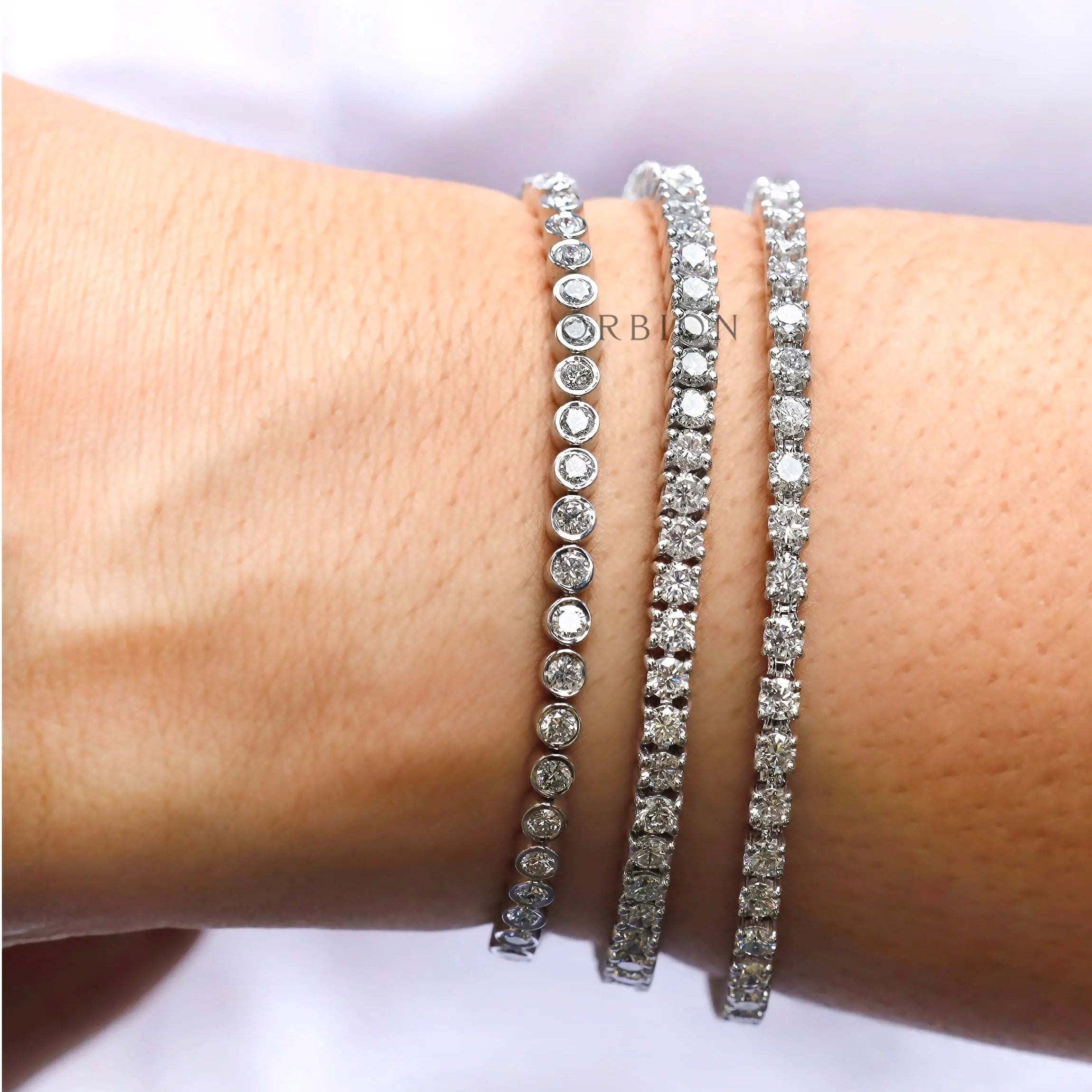 Elegant tennis bracelet worn on hand with natural lighting