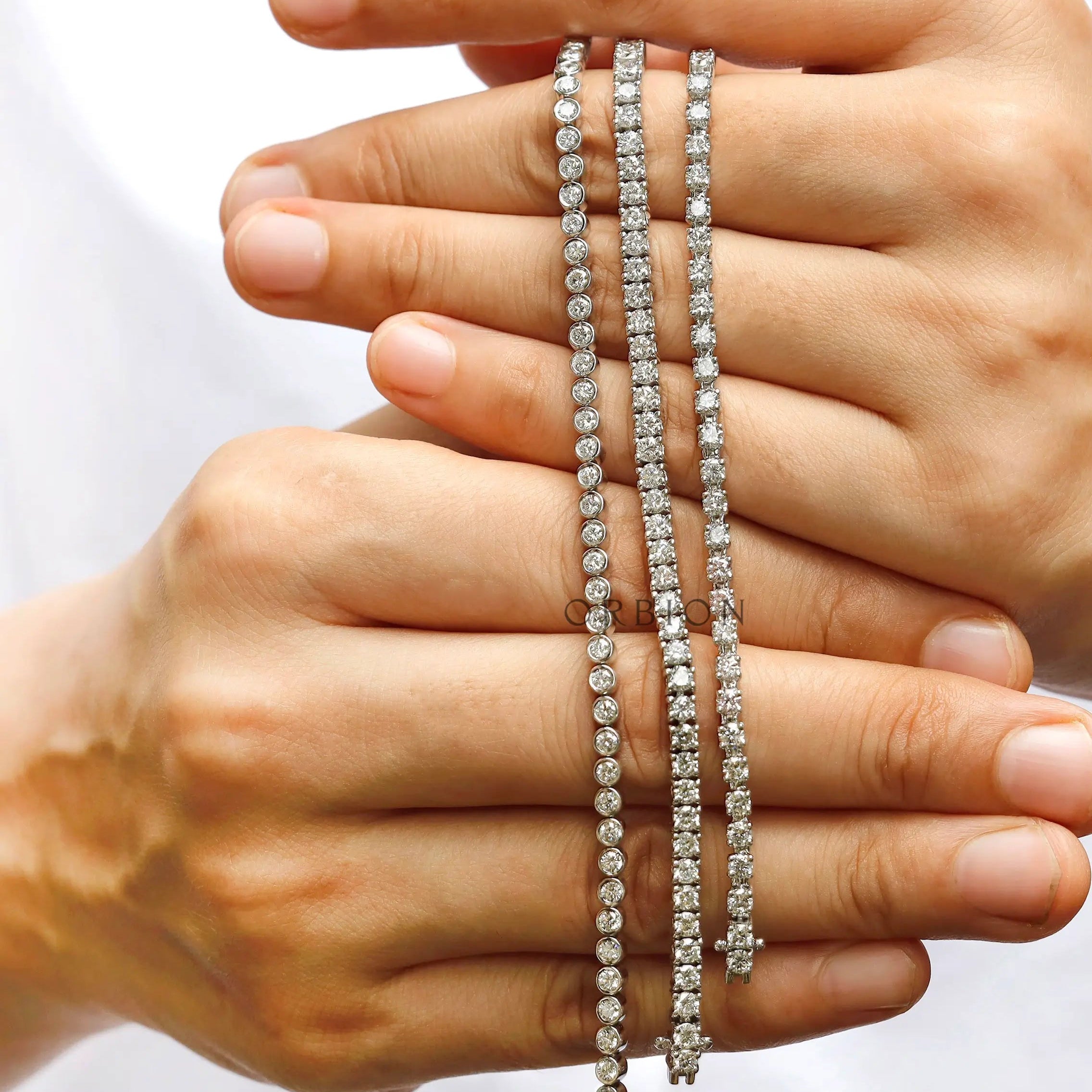 Lab diamond bracelet displayed across fingers showing length