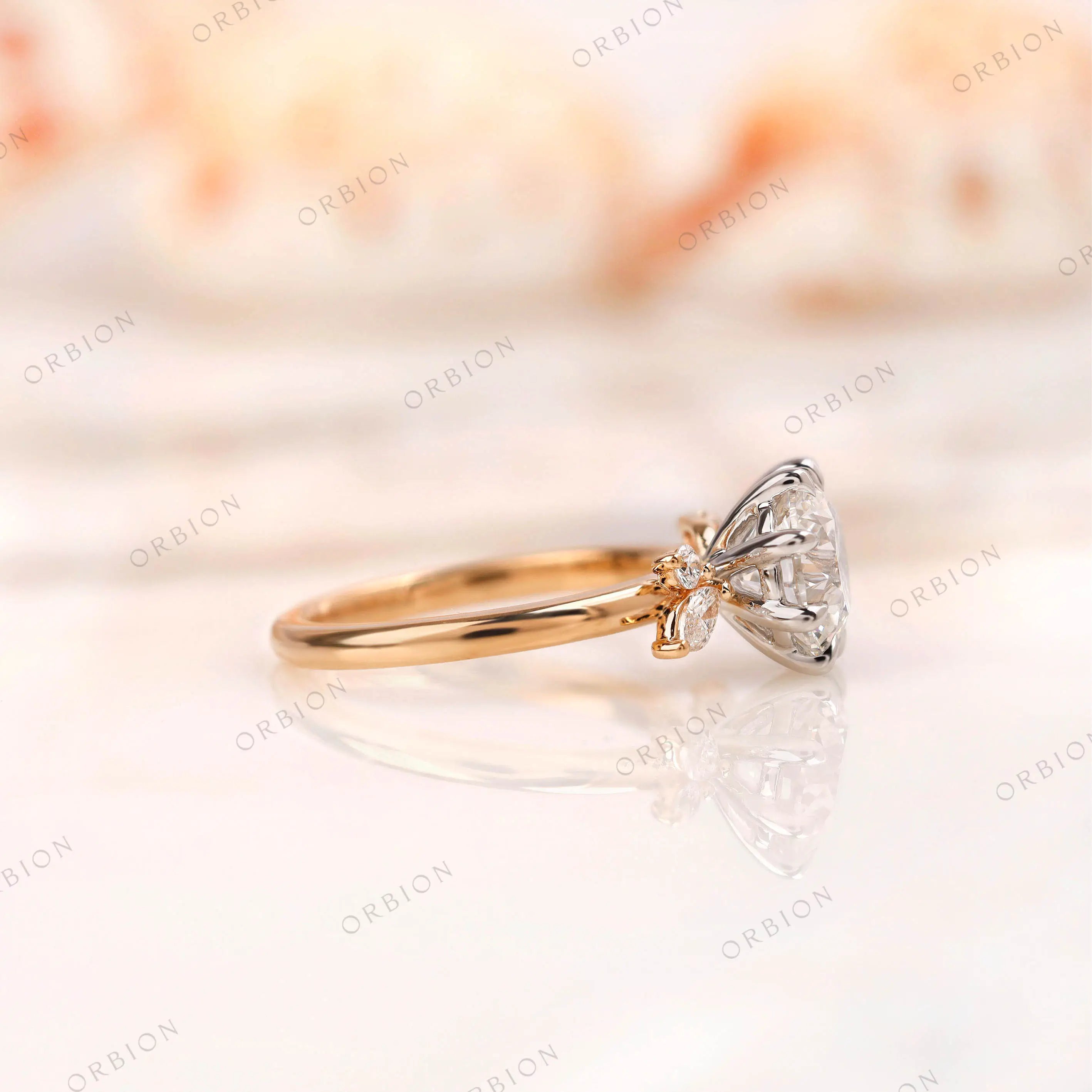 Side profile of cluster diamond ring showing white gold prongs and yellow gold band