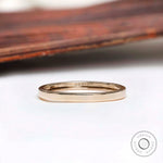 Front view of plain polished yellow gold wedding band