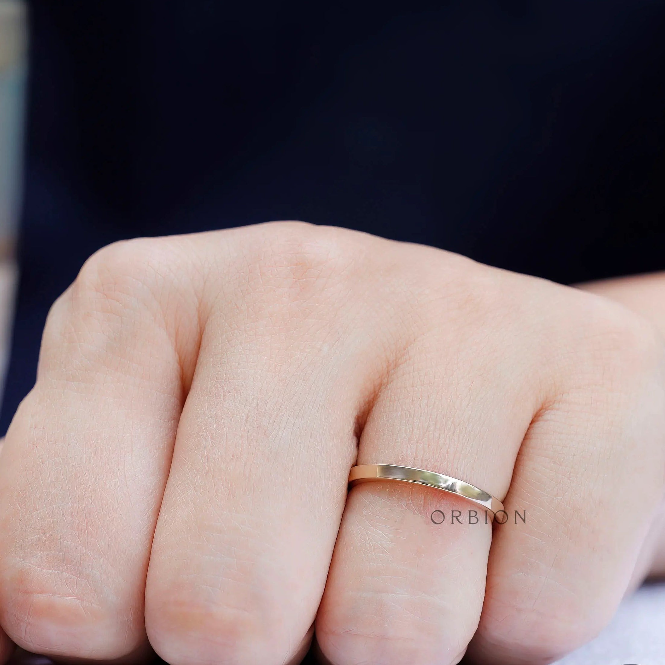 Lifestyle view of classic plain gold ring worn
