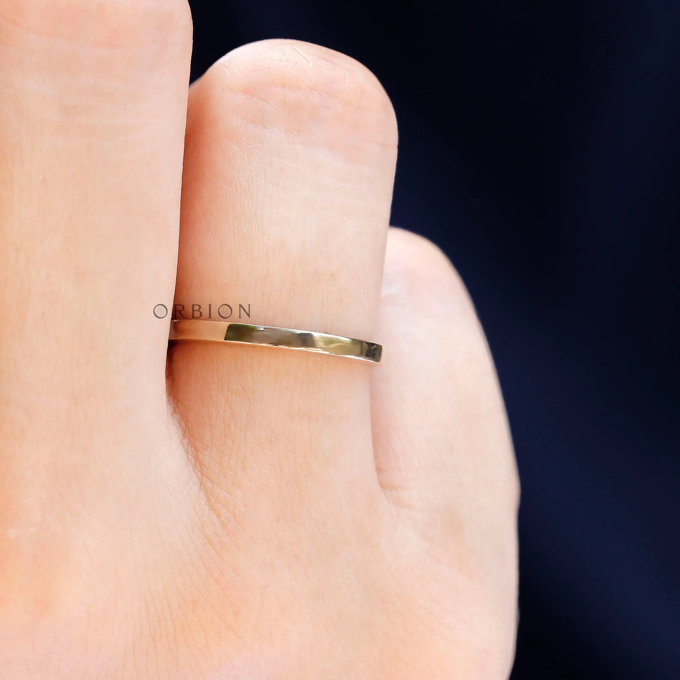 Top view highlighting minimal straight gold band