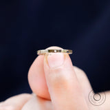 Close-up of high polish finish on plain gold band