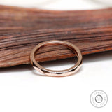 Top view of slim hammered rose gold ring