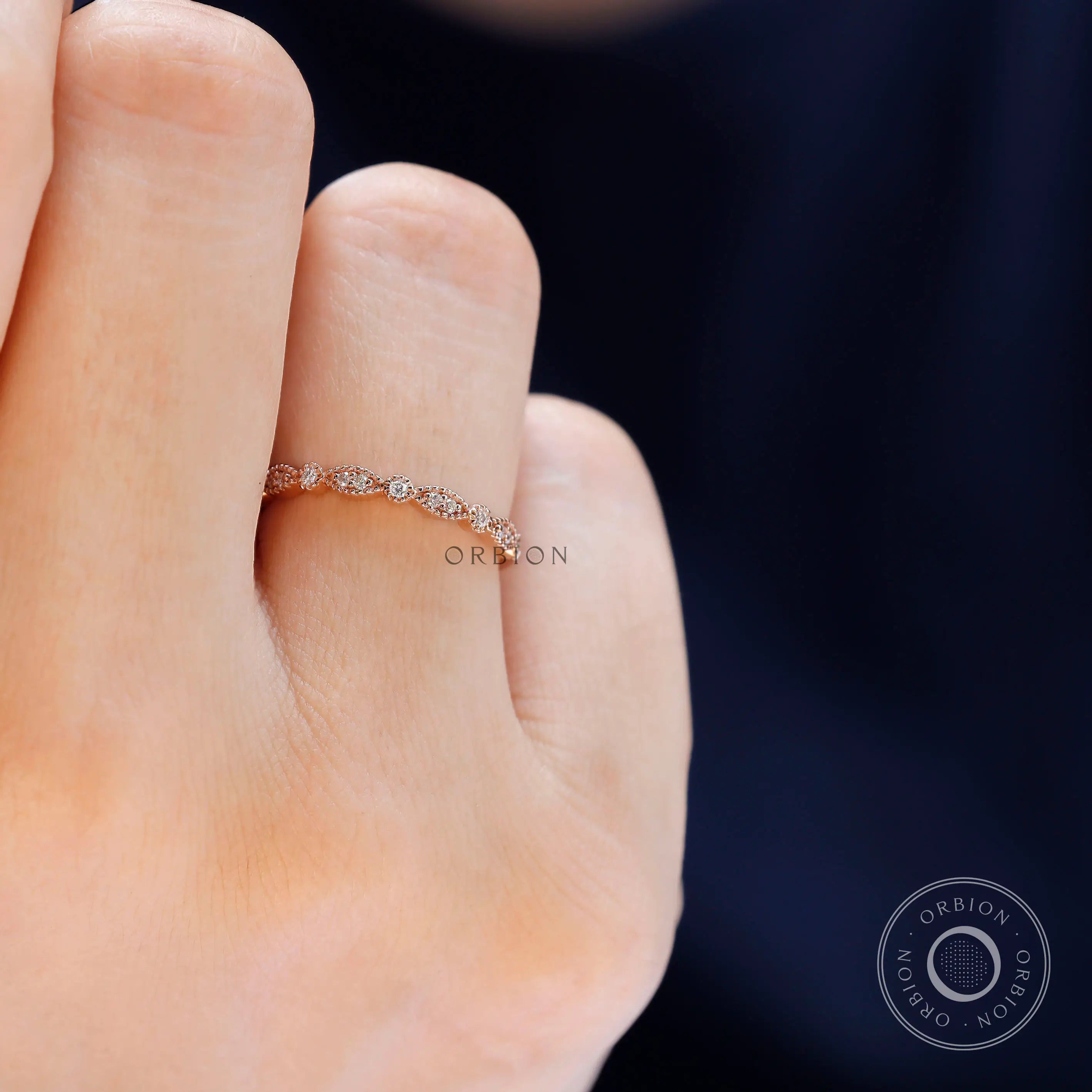 Vintage Art Deco marquise and round moissanite band styled on hand