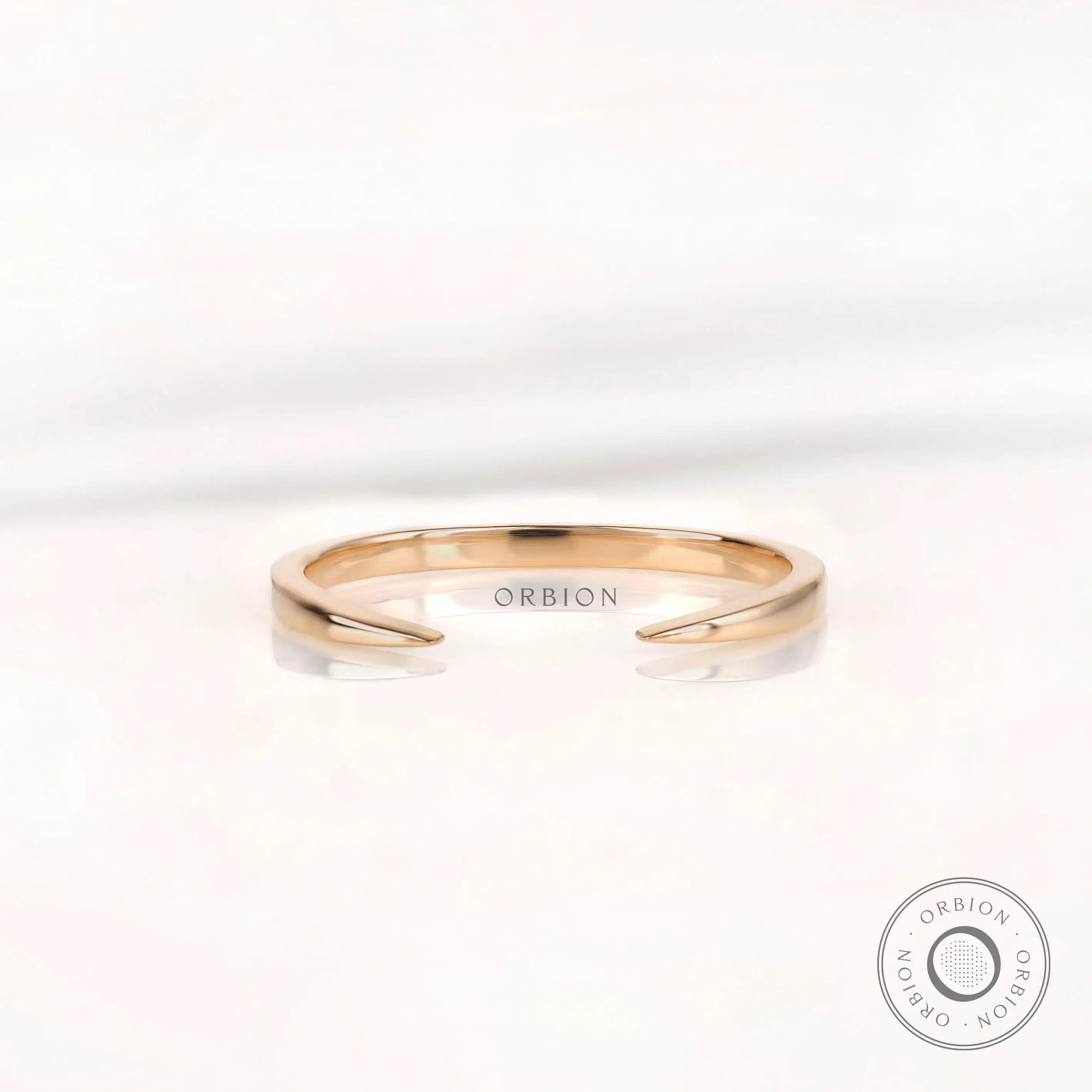 Minimalist solid gold open cuff claw wedding band front view on white background