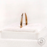 Solid gold open cuff claw band standing view showing slim band thickness