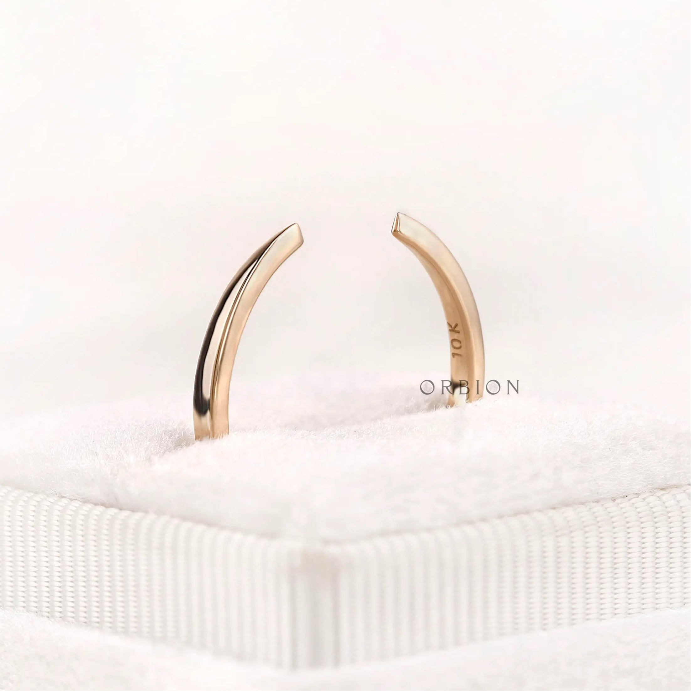 Open cuff claw wedding band close up displaying smooth polished edges