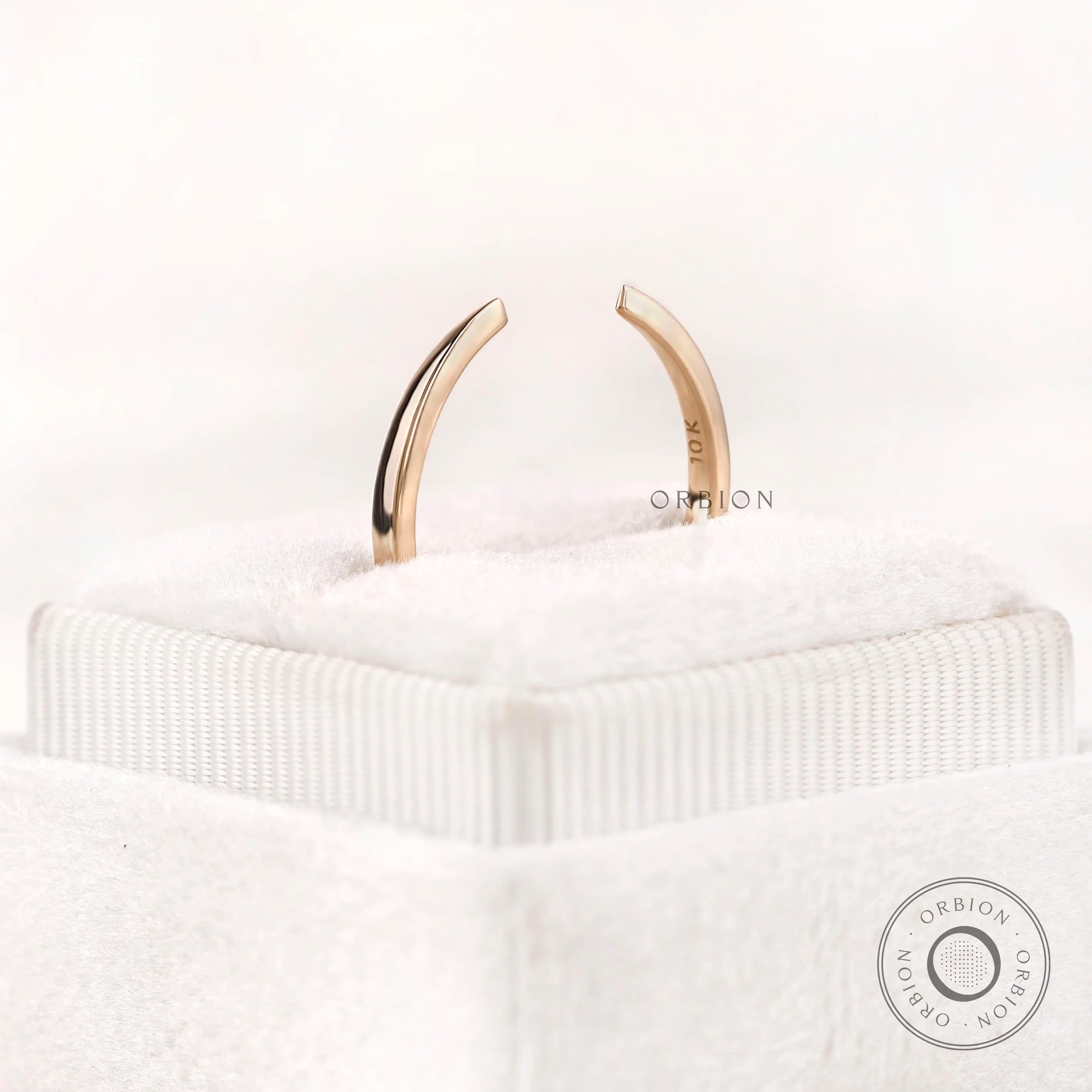 Open cuff claw wedding band close up displaying smooth polished edges