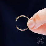 Detailed macro view of solid gold open cuff claw wedding band design