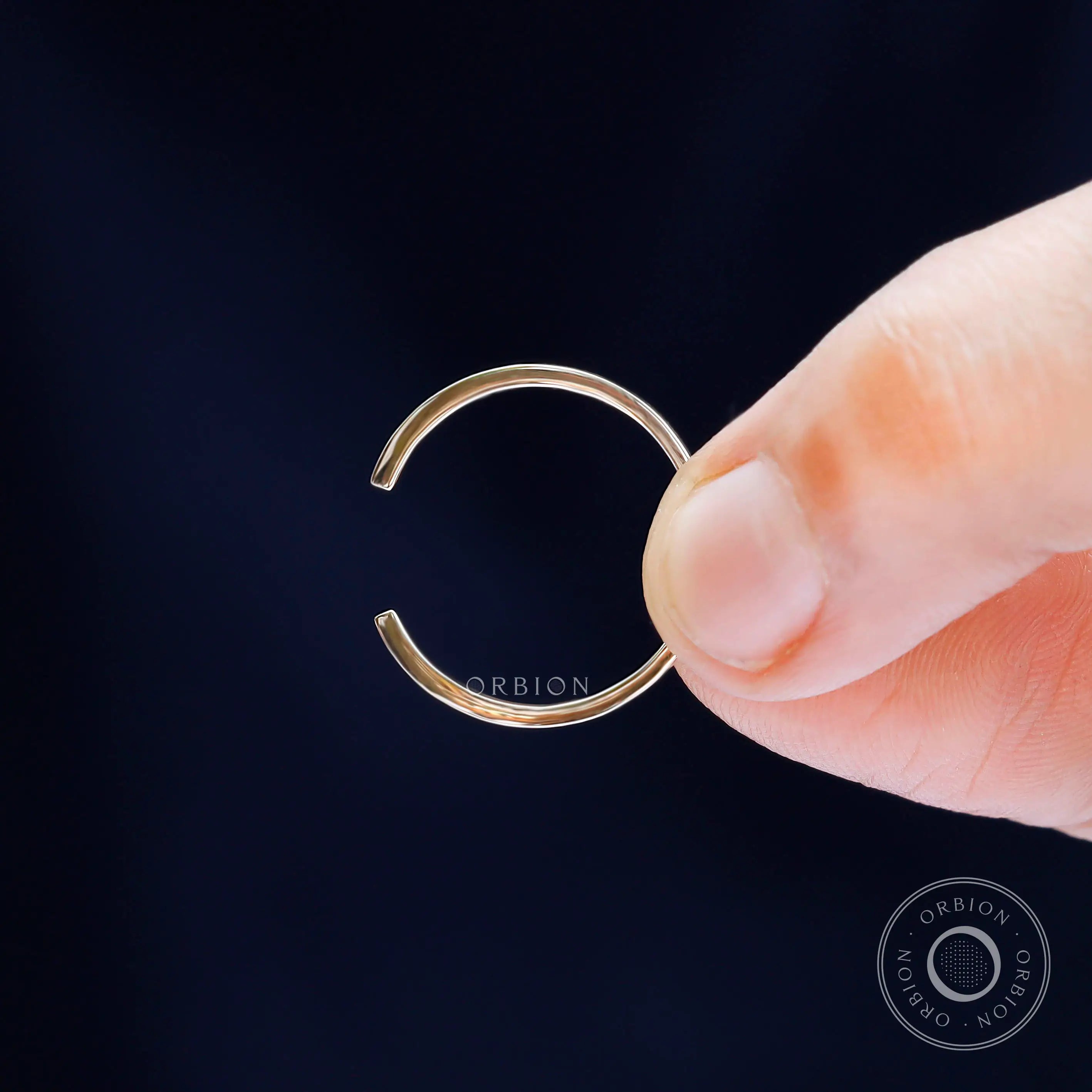 Detailed macro view of solid gold open cuff claw wedding band design