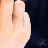 Minimalist gold open cuff band worn on finger for scale and fit reference
