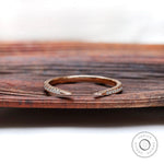 Curved open diamond wedding band in 10k rose gold