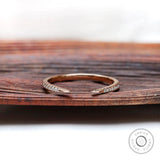 Curved open diamond wedding band in 10k rose gold