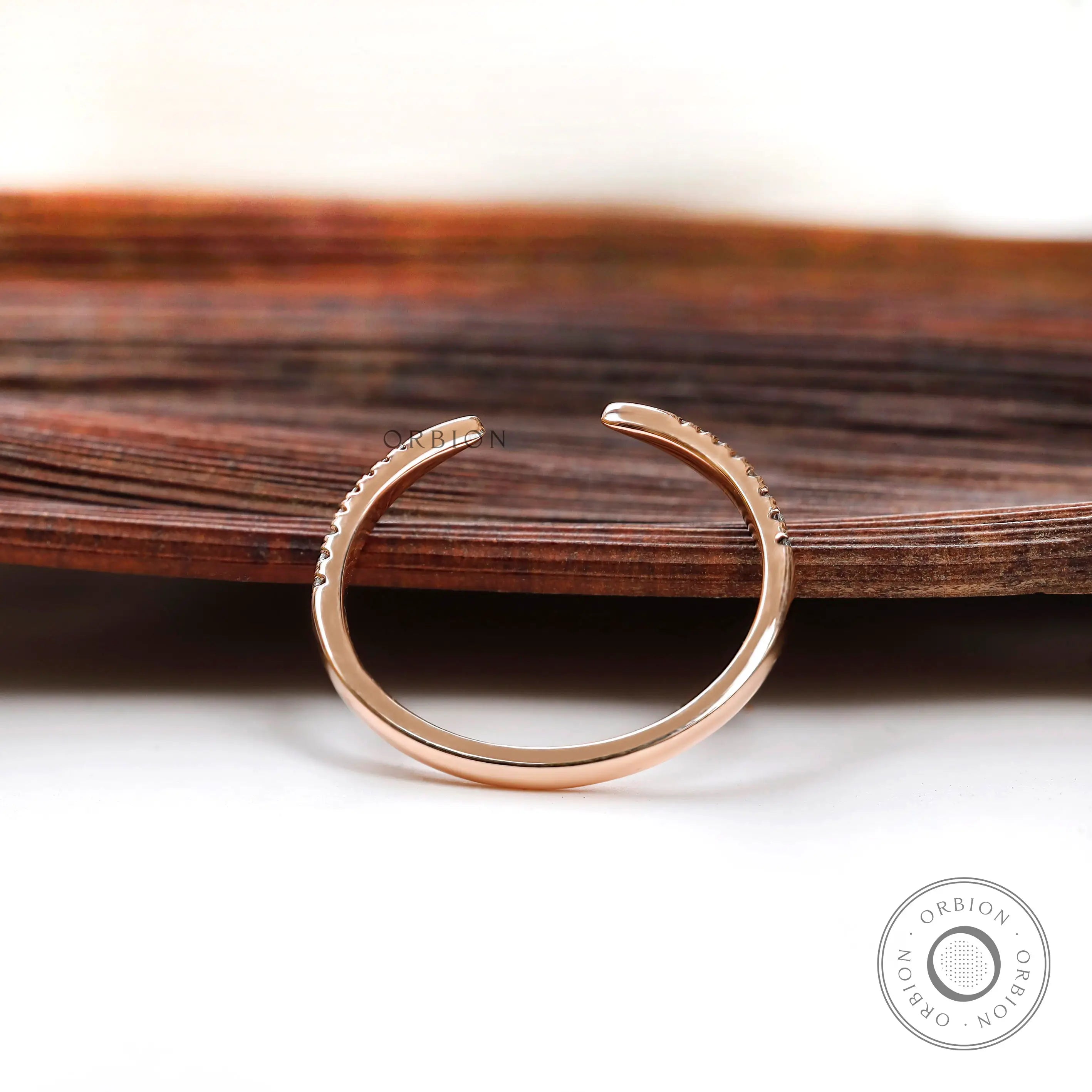 Thin rose gold diamond ring with curved profile