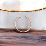 Close-up of pavé lab grown diamonds on open band ring