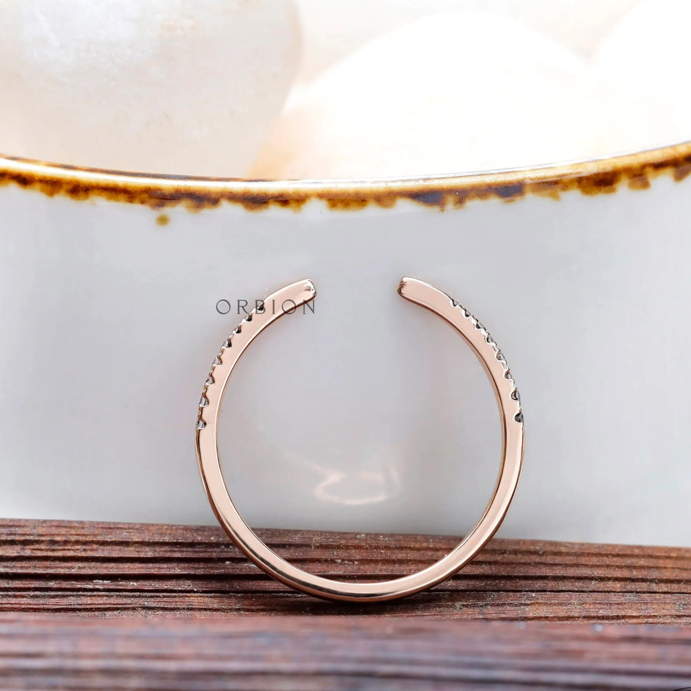 Close-up of pavé lab grown diamonds on open band ring