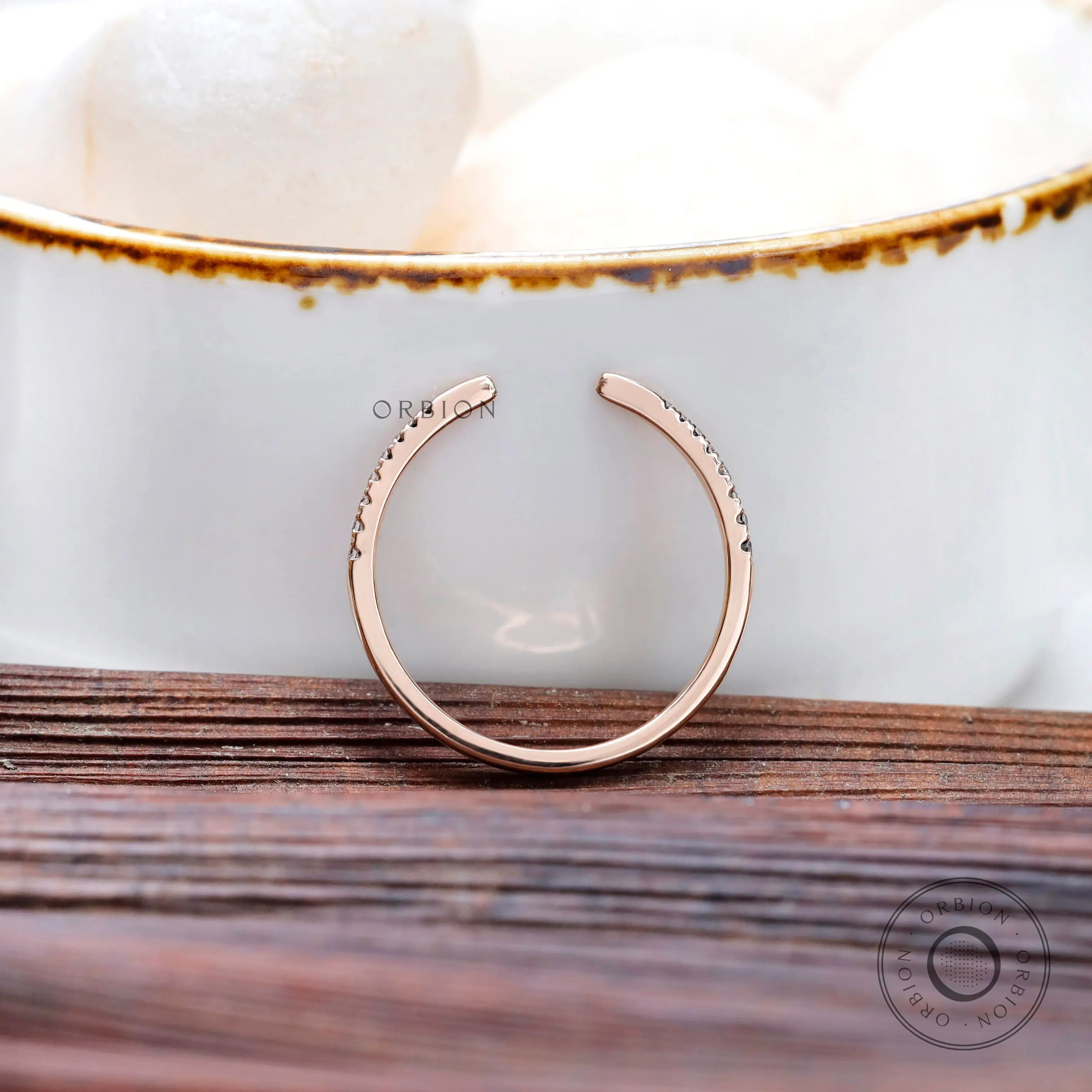 Close-up of pavé lab grown diamonds on open band ring