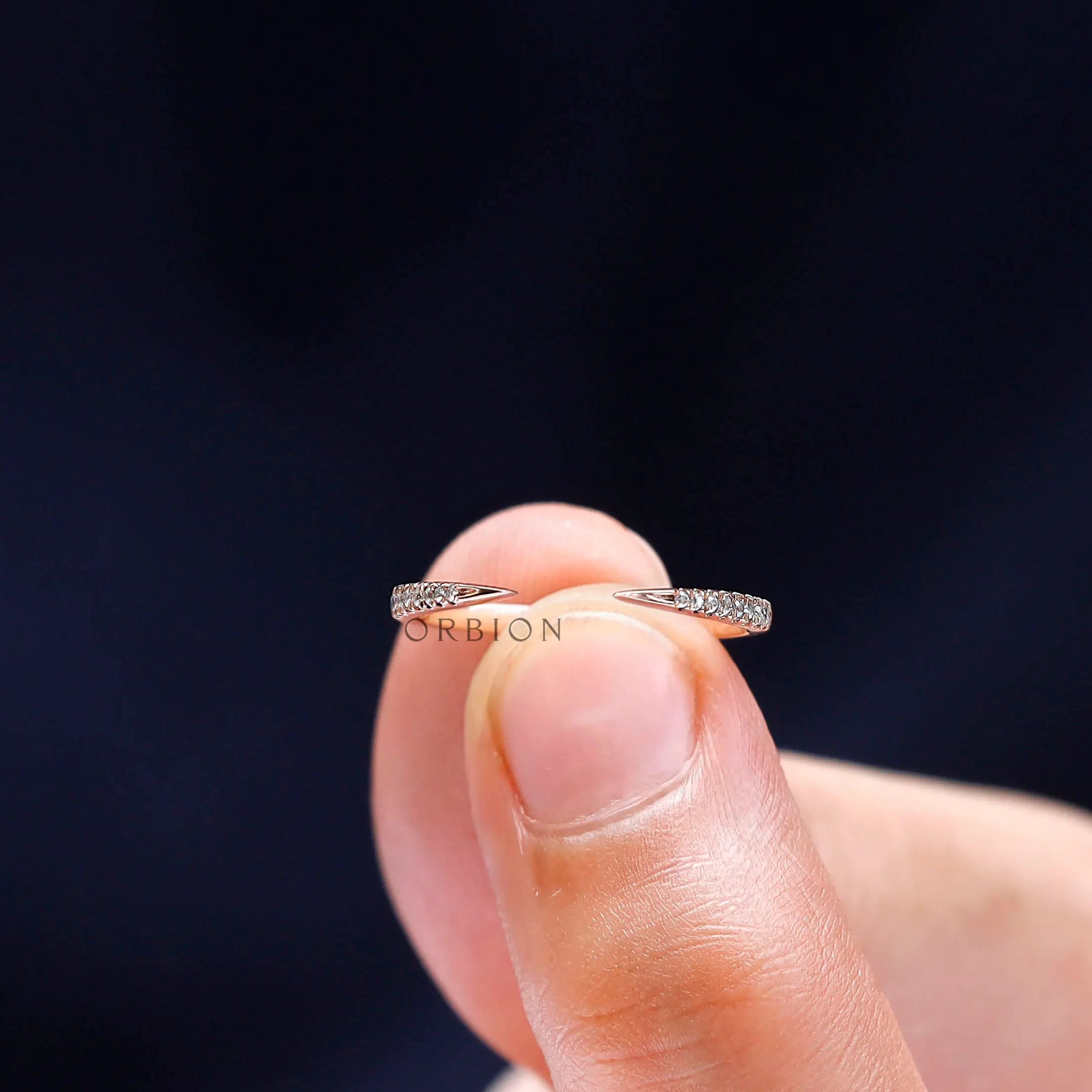 Open wedding band designed to stack with engagement rings