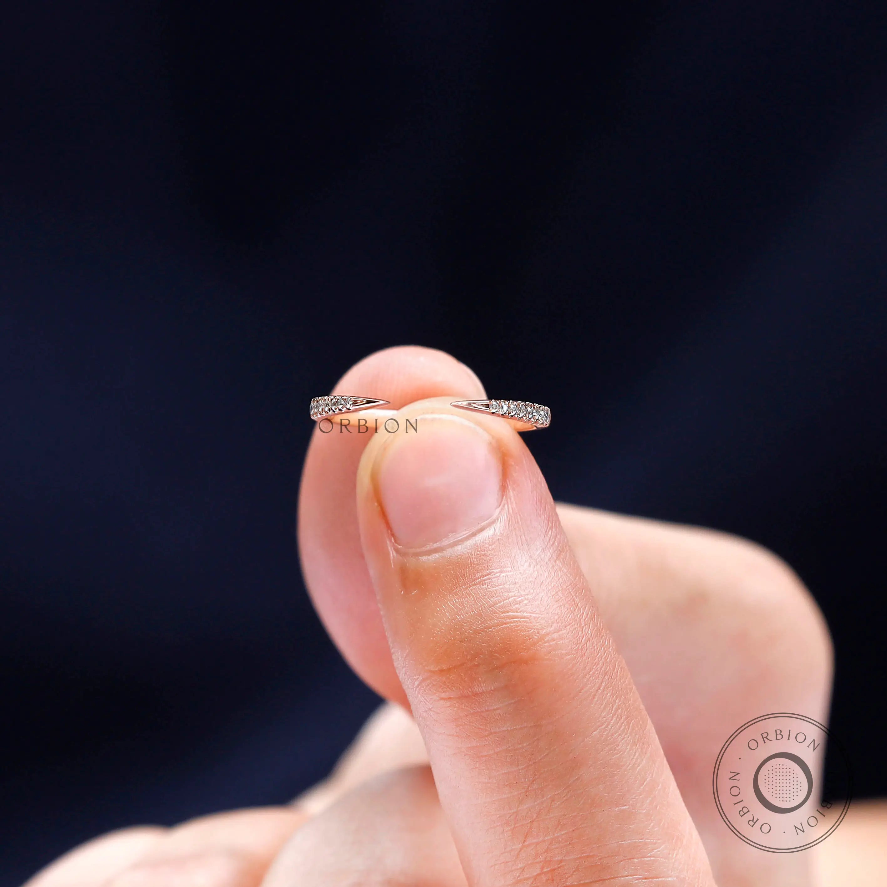 Open wedding band designed to stack with engagement rings