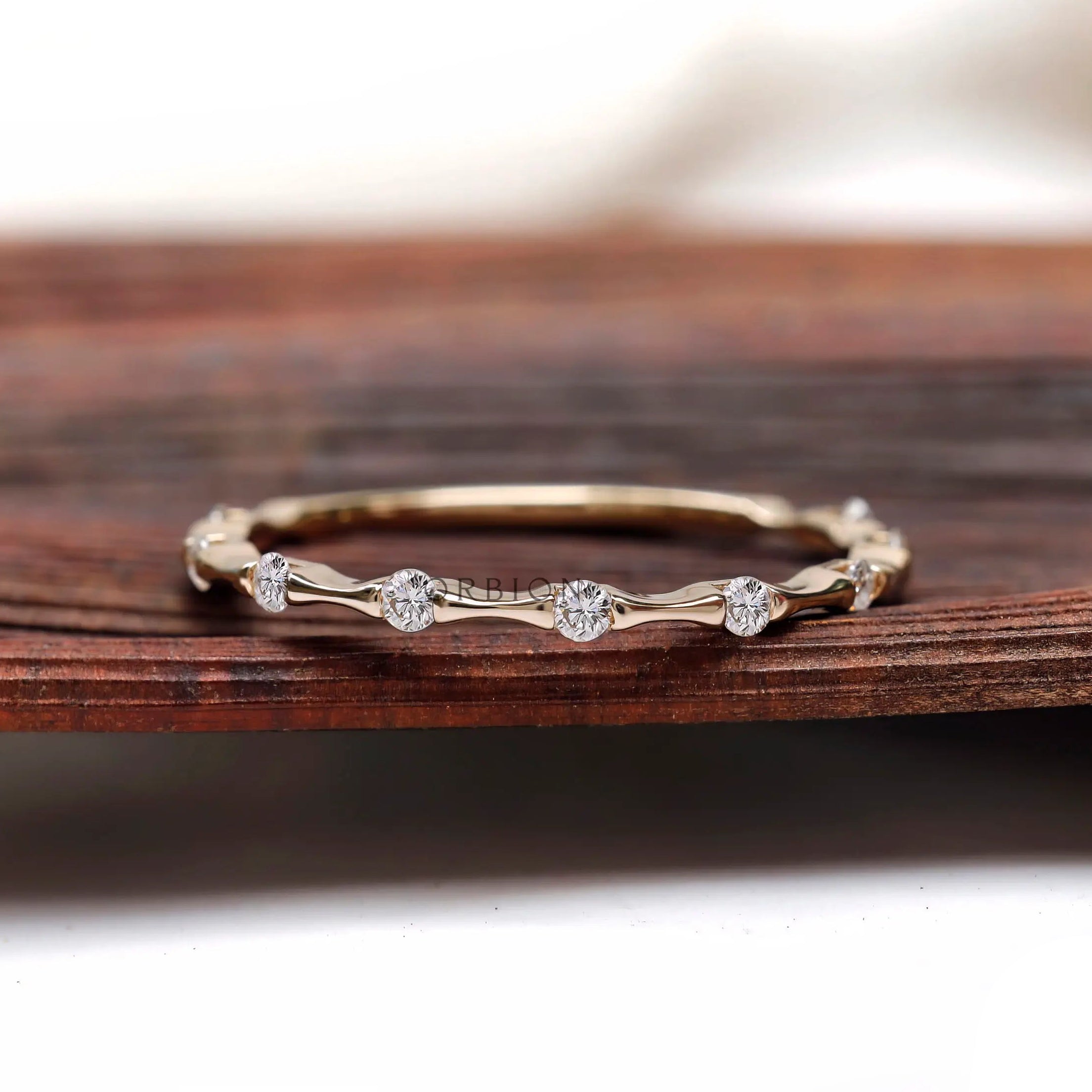 Bamboo style thin moissanite wedding band front view