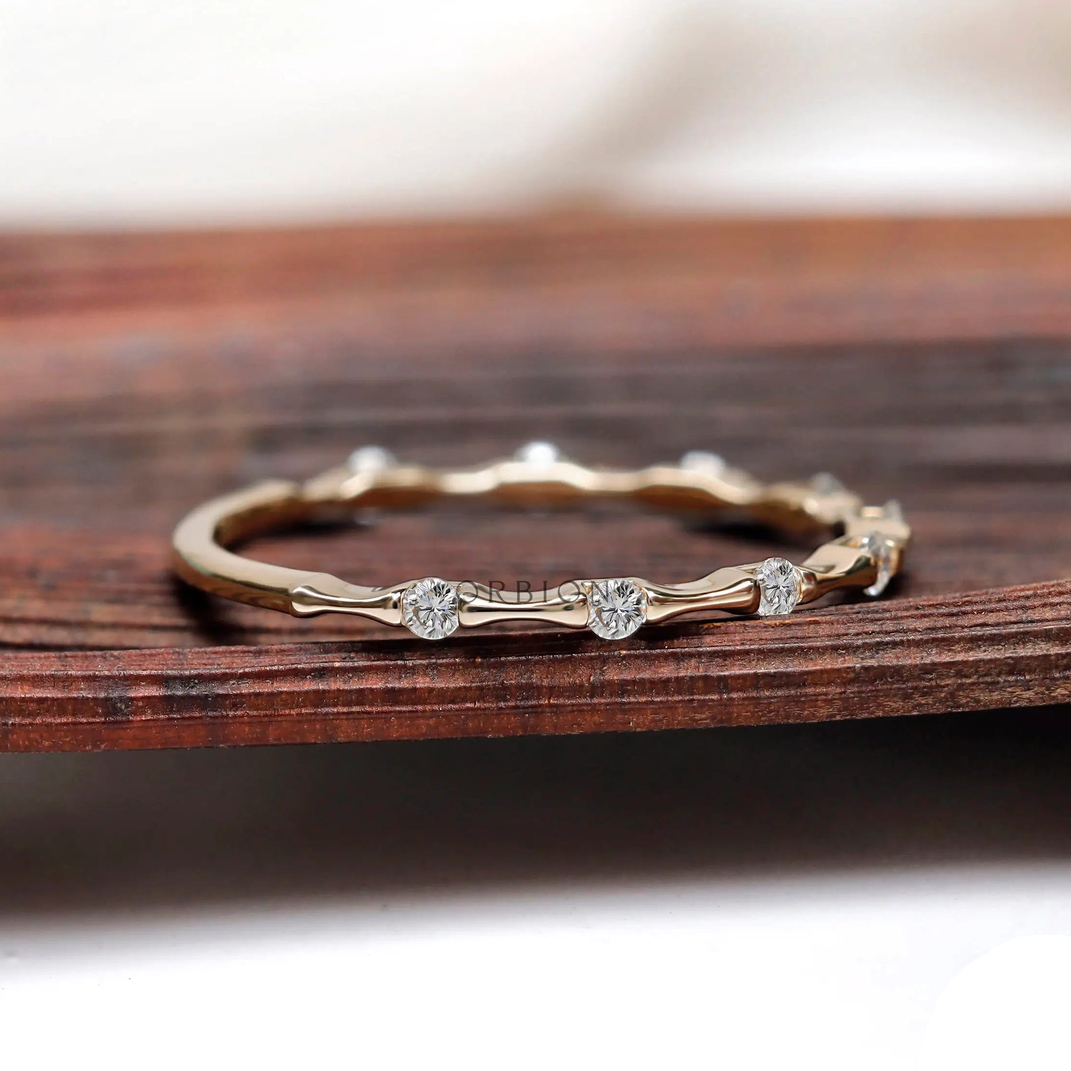 Minimalist bamboo inspired moissanite band side angle
