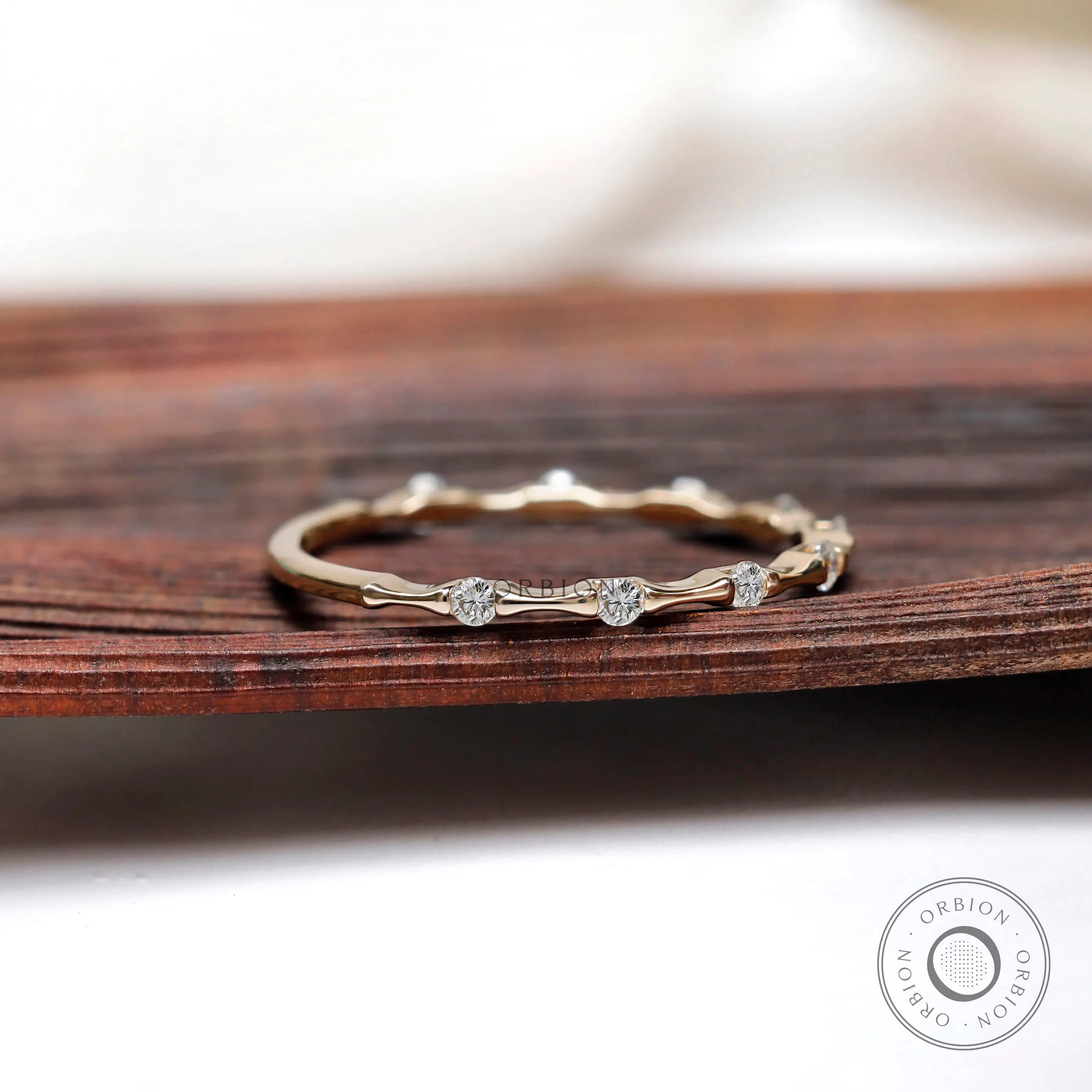 Minimalist bamboo inspired moissanite band side angle