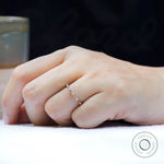 Delicate bamboo design moissanite wedding ring close up