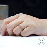 Delicate bamboo design moissanite wedding ring close up