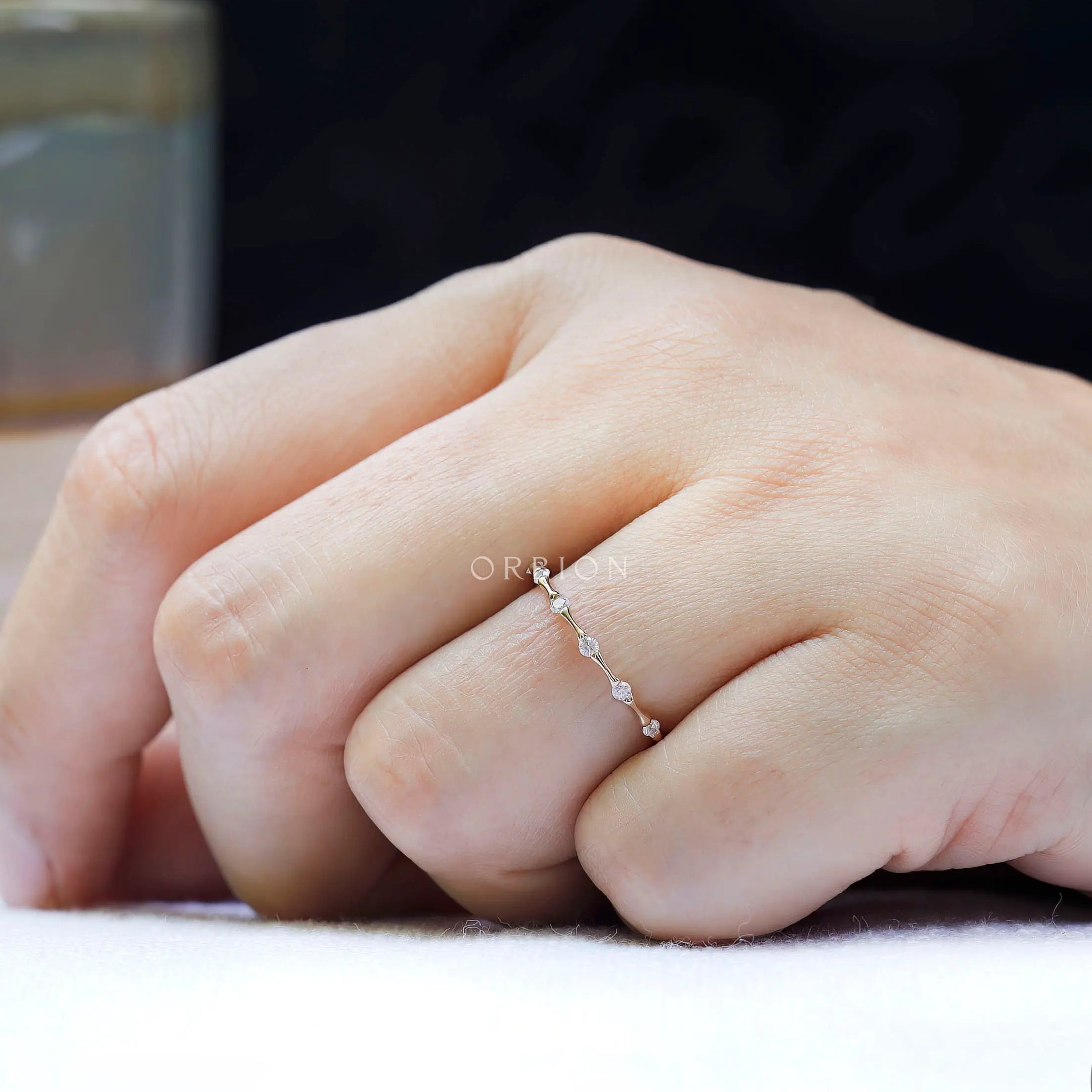 Delicate bamboo design moissanite wedding ring close up