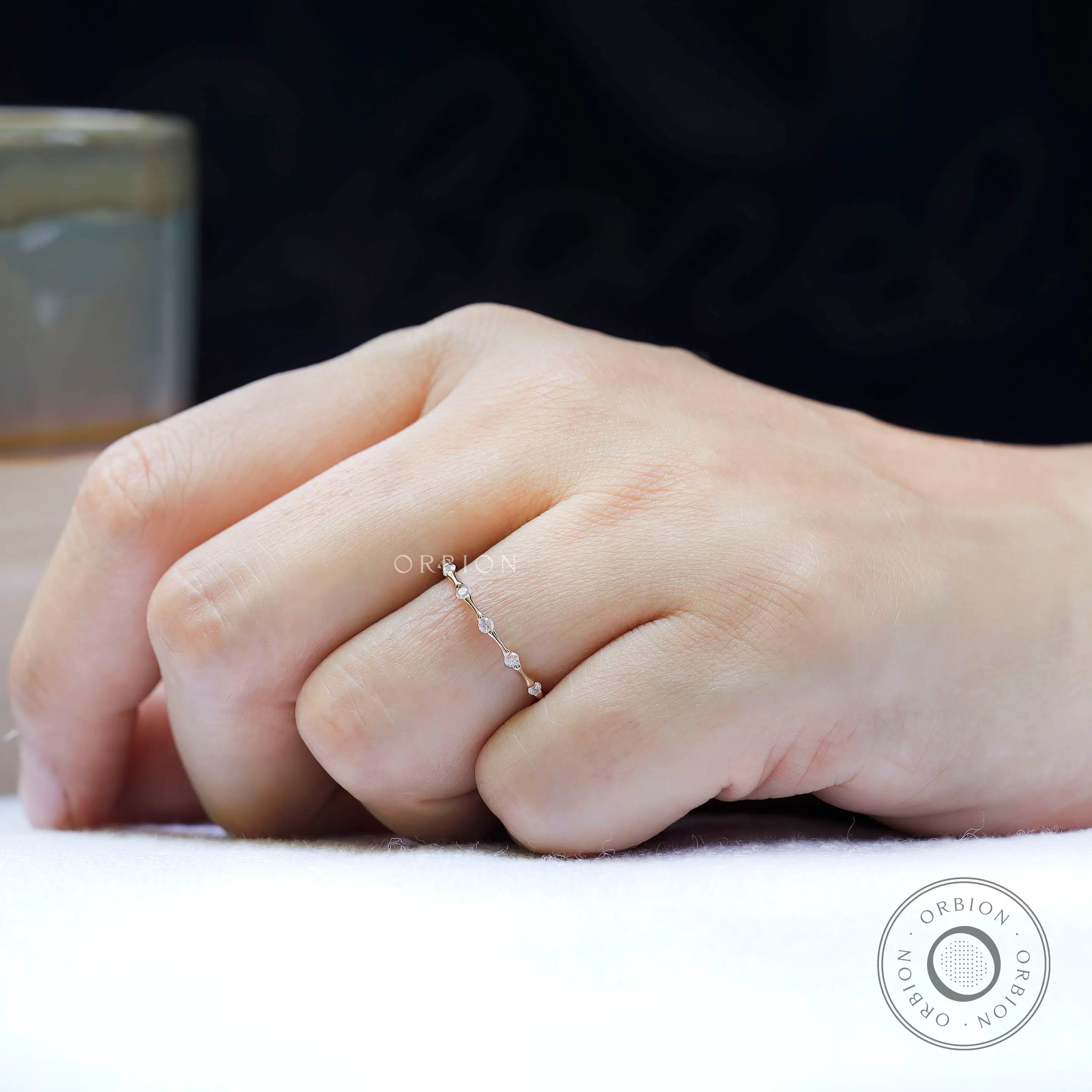Delicate bamboo design moissanite wedding ring close up