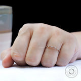 Slim bamboo style moissanite ring worn on hand