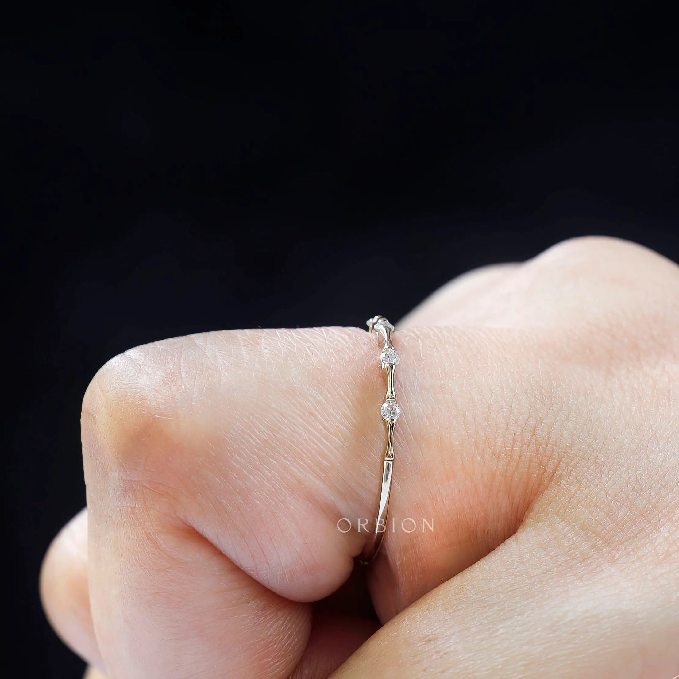 Minimalist moissanite bamboo band finger profile view