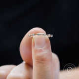 Thin modern bamboo wedding band detailed stone setting