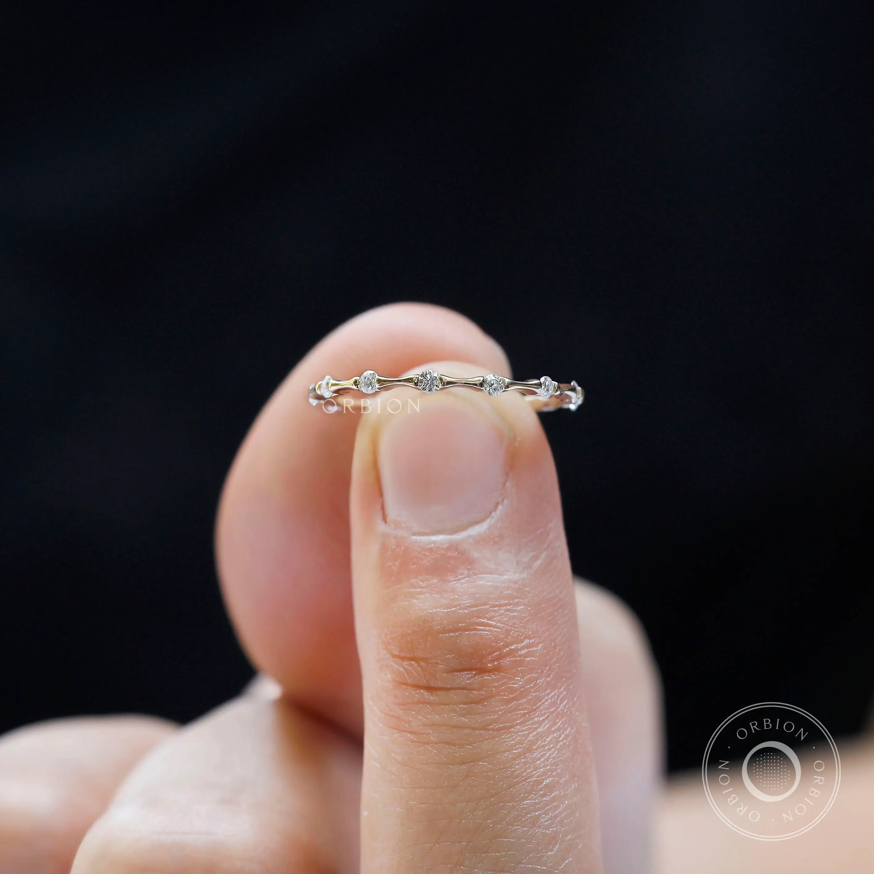 Thin modern bamboo wedding band detailed stone setting