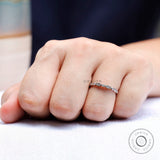 On-hand angle showing the sparkle and pattern of the half eternity band.