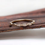 Front view geometric marquise milgrain moissanite wedding band