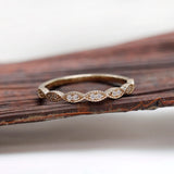 Front view geometric marquise milgrain moissanite wedding band