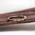 Side profile of geometric moissanite wedding band