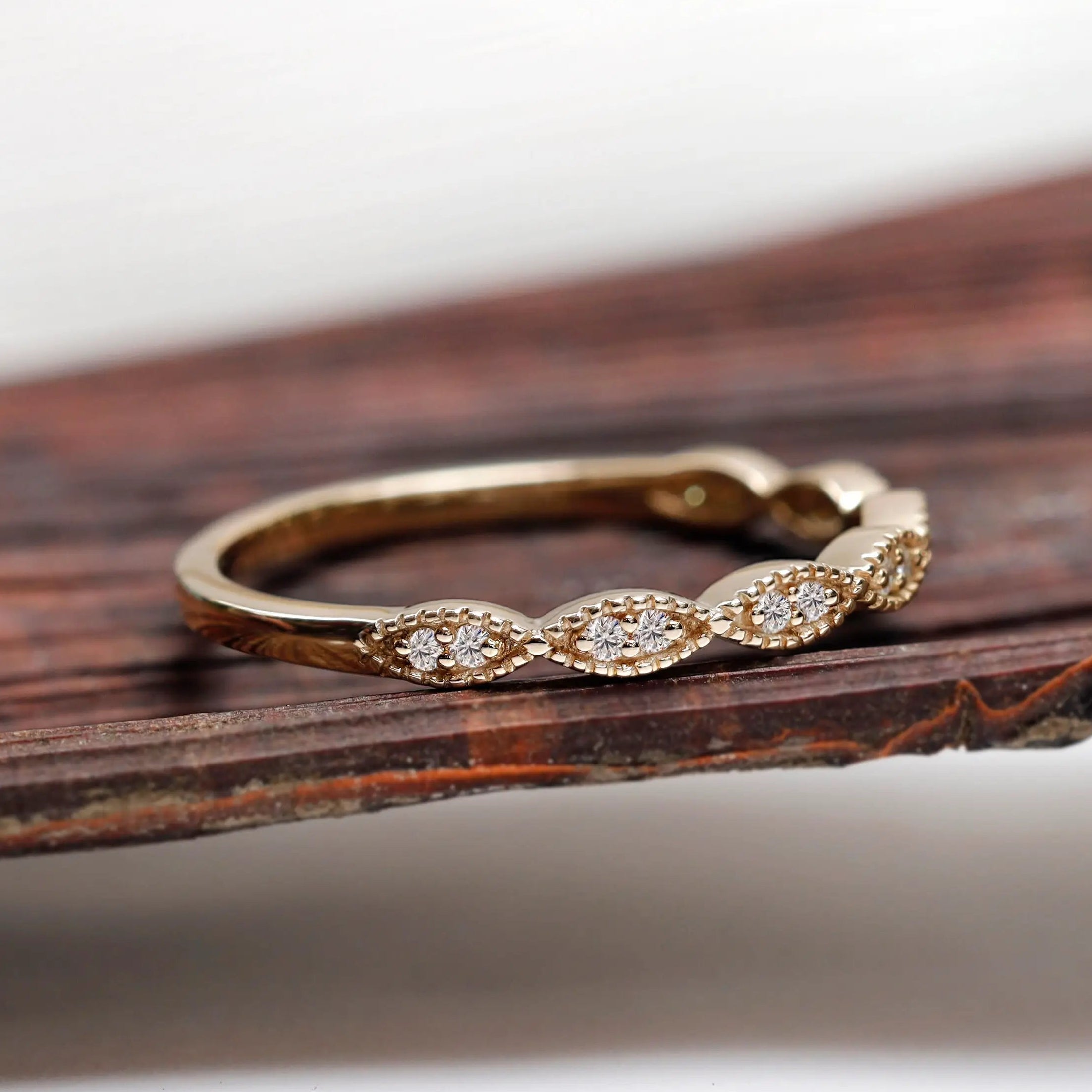 Side profile of geometric moissanite wedding band
