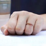 Lifestyle shot of geometric milgrain moissanite band