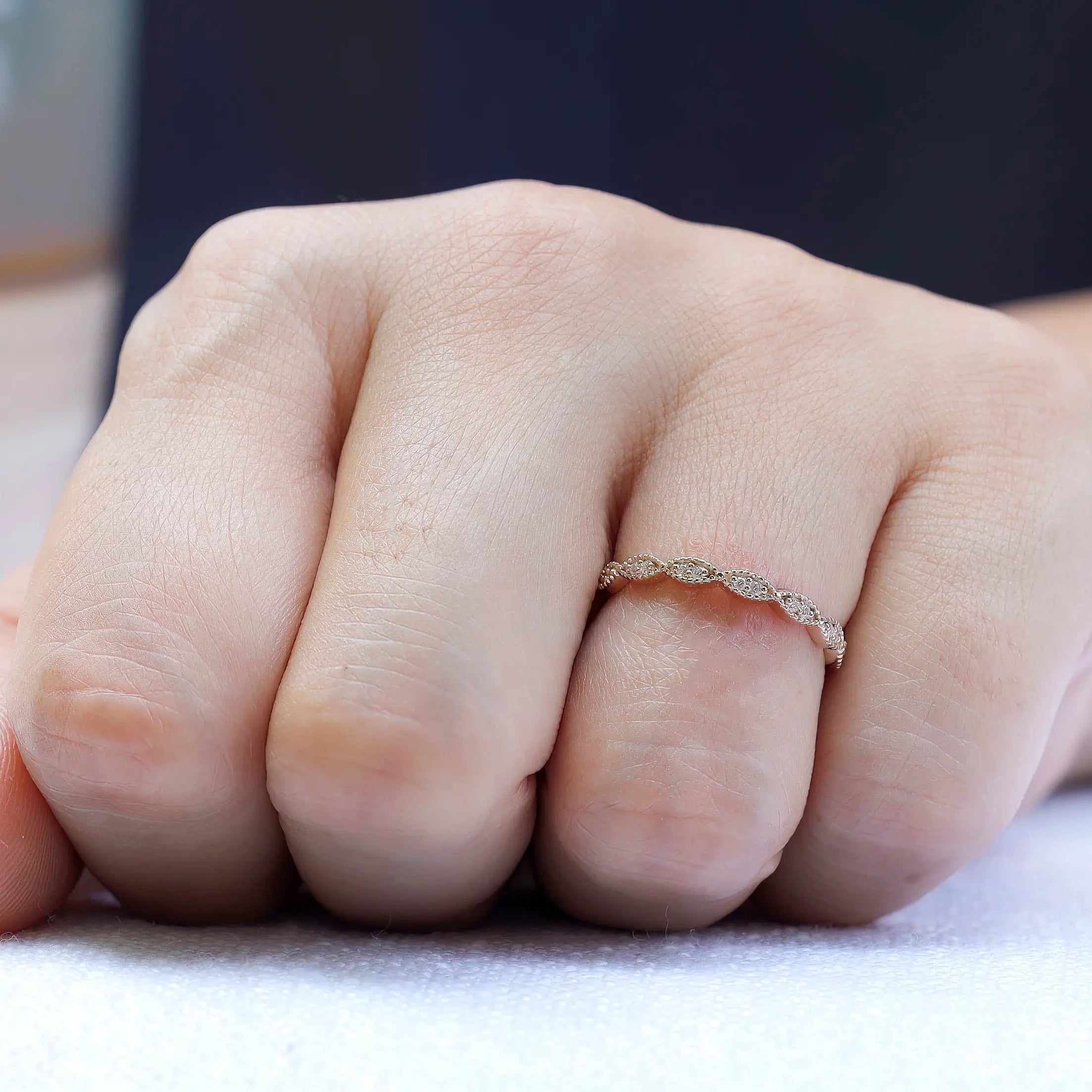 Lifestyle shot of geometric milgrain moissanite band