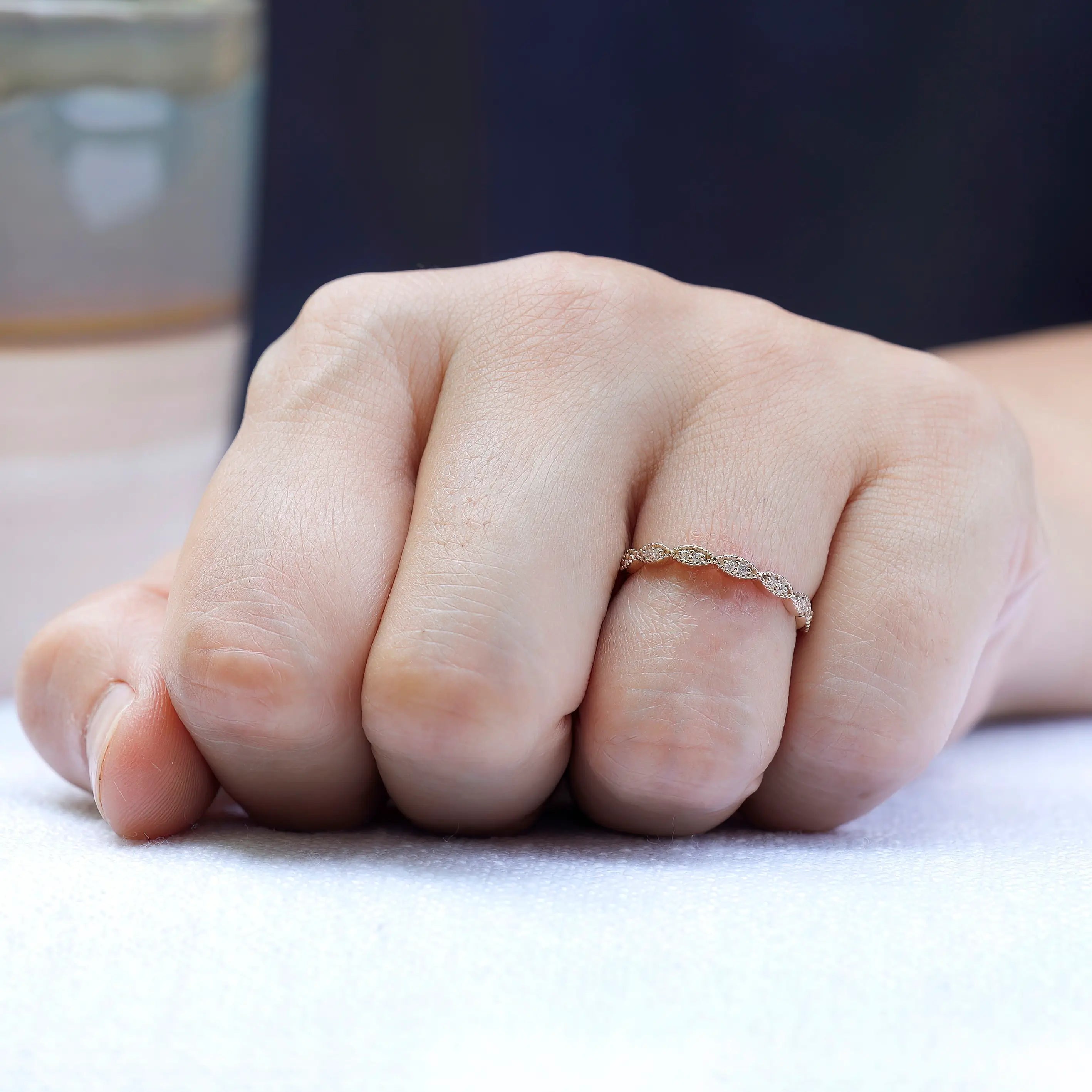 Lifestyle shot of geometric milgrain moissanite band