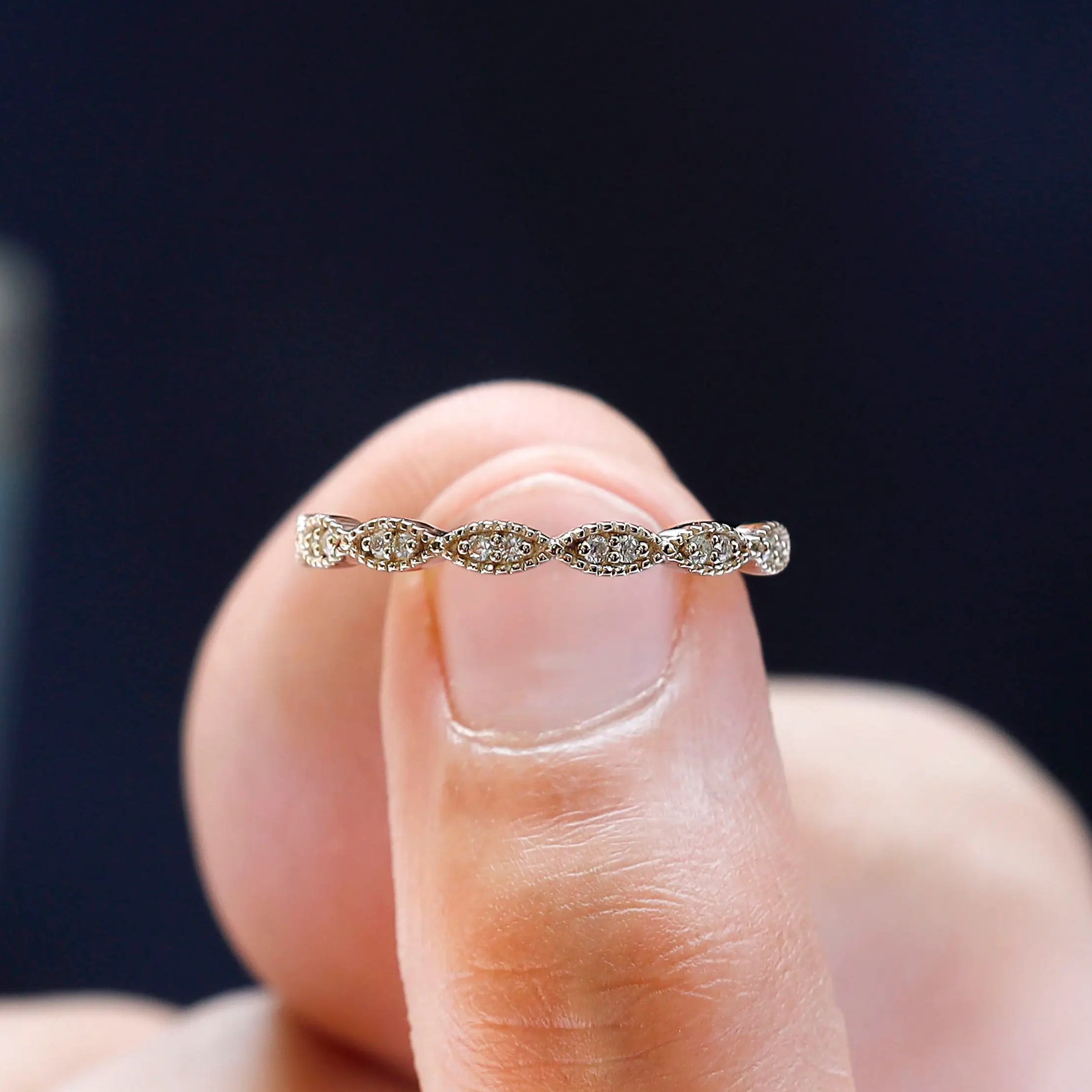 Close-up detail of round moissanite geometric setting